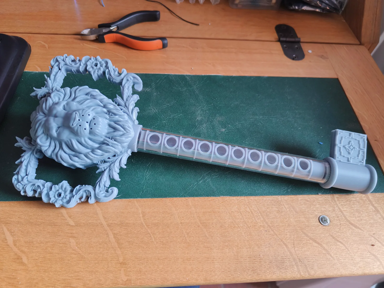 The real, hand-built Skeleton Key prop for the Puzzle Quests walking route, a lion's-head brass key